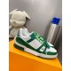 L Trainer Sneaker In Green And White Monogram Leather Profile View Angled profile of L Trainer Sneaker in green and white resting on an orange shoe box