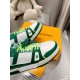 L Trainer Sneaker In Green And White Monogram Leather Toe Detail Close-up of the toe box and front paneling on the green and white L Trainer Sneaker