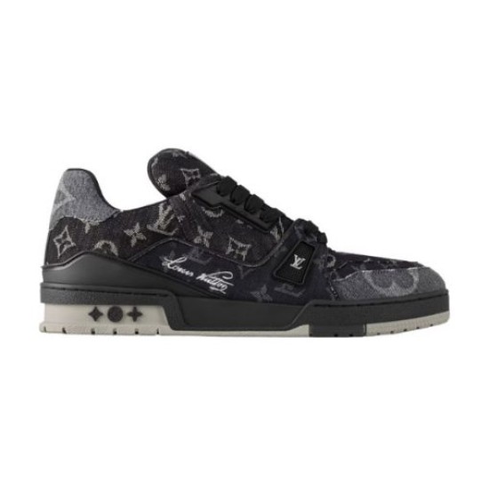 L Monogram Denim Low Top Trainer Sneakers Studio View in denim and black Studio side profile of L Monogram Denim Low Top Trainer Sneakers against white background in denim and black