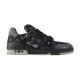 L Monogram Denim Low Top Trainer Sneakers Studio View in denim and black Studio side profile of L Monogram Denim Low Top Trainer Sneakers against white background in denim and black