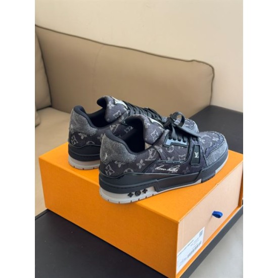 L Monogram Denim Low Top Trainer Sneakers Rear Angle in denim and black Rear angle view of L Monogram Denim Low Top Trainer Sneakers displaying heel in denim and black