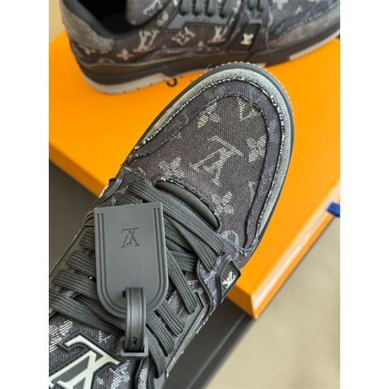 L Monogram Denim Low Top Trainer Sneakers Toe Detail in denim and black Close-up of toe box and lacing system on L Monogram Denim Low Top Trainer Sneakers in denim and black