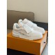L Beige Trainers Angled Perspective in beige and white Angled perspective of L beige trainers placed together on a box in beige and white