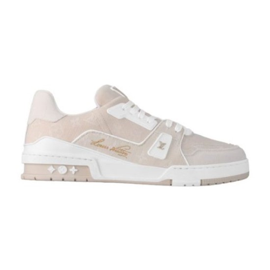 L Beige Low Top Trainer Studio Profile in beige and white Studio side profile of L beige low top trainer on a neutral background in beige and white