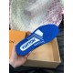 Underside view of L Trainer Rhinestone Blue White Leather Low Top Sneakers showing blue rubber tread pattern