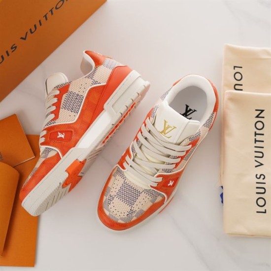 L Trainer Sneaker In Orange And White Damier Print Perspective View Close-up perspective of L Trainer Sneaker In Orange And White Damier Print showing upper texture