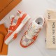 L Trainer Sneaker In Orange And White Damier Print Perspective View Close-up perspective of L Trainer Sneaker In Orange And White Damier Print showing upper texture
