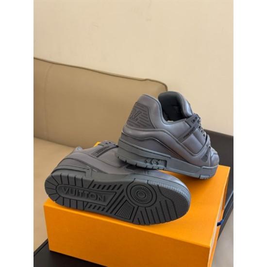 Underside tread pattern and heel detail of the grey L trainers alongside a second shoe in monochrome and grey