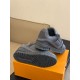 Underside tread pattern and heel detail of the grey L trainers alongside a second shoe in monochrome and grey