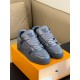 Front three-quarter angle showcasing the toe box and laces of the grey L trainers in monochrome and grey