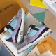 Angle shot showing two L Trainer Sneakers in light blue and purple inside packaging
