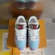 Overhead view of L Trainer Sneakers in light blue and purple highlighting toe boxes
