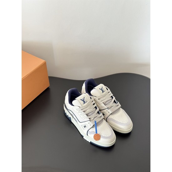 L Trainer Sneaker Low Top Leather White Navy Front Angle L Trainer Sneaker Low Top Leather White Navy angled front view on dark surface