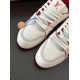 Close up of the toe box and laces on L white and red trainers