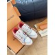 High angle view of L white and red leather trainers