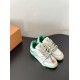 L Trainer Sneakers Three-Quarter Angle in white and green Three-quarter view of white and green L leather trainers