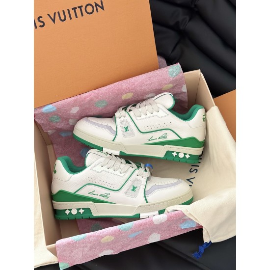 L Trainer Sneakers Boxed Pair in white and green Pair of L white and green trainers resting inside their original orange shoe box