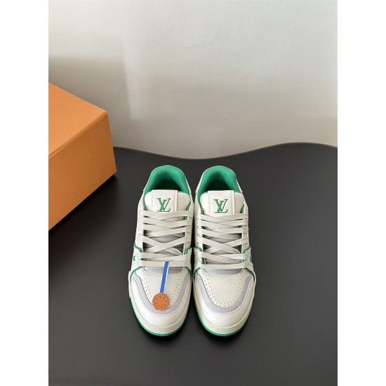 L Trainer Sneakers Front Facing View in white and green Front view showing tongues and lace-up fronts of white and green L trainers