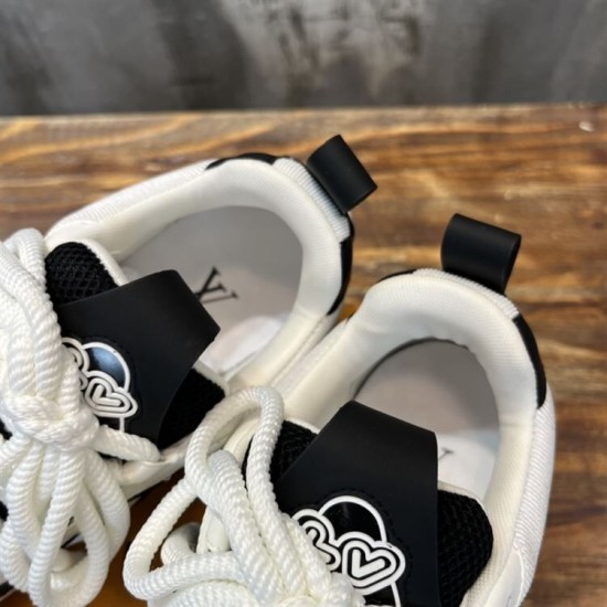L Skater Style Chunky Black And White Trainers Heel Collars Close-up of heel collars and pull loops on L skater style chunky black and white trainers