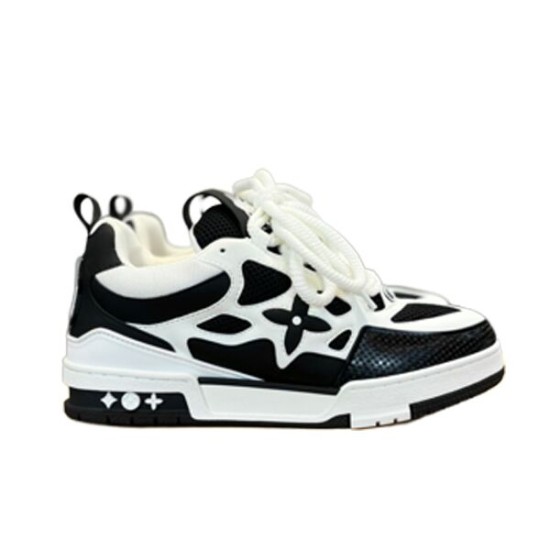 L Skater Style Chunky Black And White Trainers Profile View Profile view of L skater style chunky black and white trainers showing floral side overlays