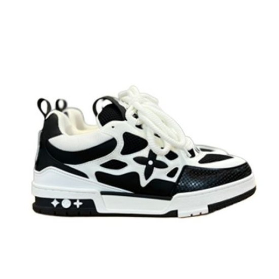 L Skater Style Chunky Black And White Trainers Studio View Studio profile view of L skater style chunky black and white trainers against a white backdrop