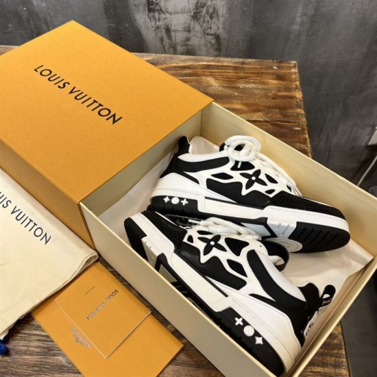 L Skater Style Chunky Black And White Trainers Boxed Set L skater style chunky black and white trainers neatly packed inside an orange presentation box