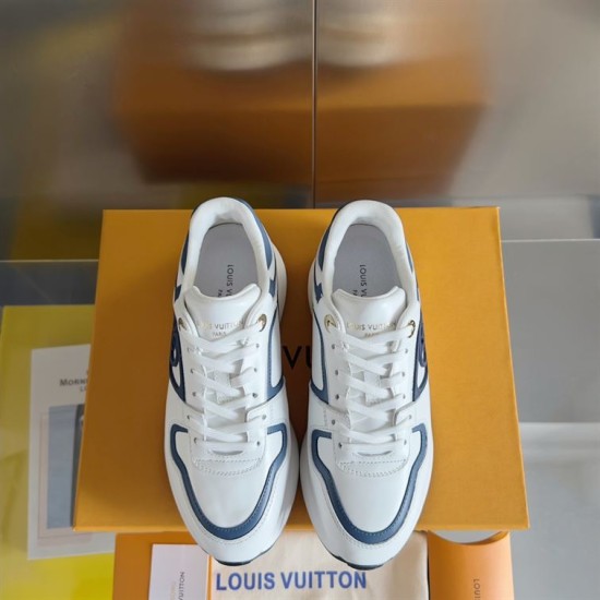 L Trainers White and Blue Lacing Detail Direct top-down view of L trainers in white and blue showing laces