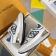 L Trainers White and Blue Packaging View Top diagonal view of L trainers in white and blue inside packaging