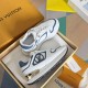 L Trainers White and Blue Elevated Box View Elevated perspective of L trainers in white and blue in storage box