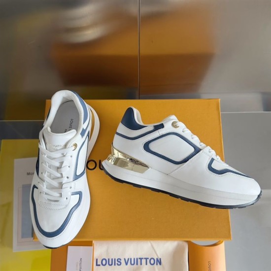 L Trainers White and Blue Rear Angle Rear angle view of L trainers in white and blue with gold heel panel