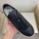 L Resort Black Trainer Tongue and Footbed Detail in black and white Top-down hand-held view showing the tongue logo detail and footbed of a black trainer in black and white