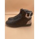 L Rivoli High-Top Leather Monogram Trainers In Black - Inner Angle Angled view focusing on the inner side of the black L high-top trainers