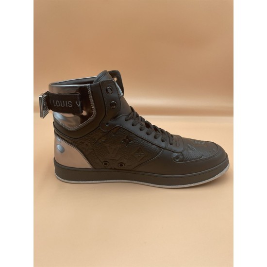 L Rivoli High-Top Leather Monogram Trainers In Black - Outer Side View Outer side perspective of the black L high-top trainers featuring the metallic buckle strap