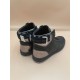 L Rivoli High-Top Leather Monogram Trainers In Black - Rear View Rear view of the black L high-top trainers showcasing the branded ankle straps and metallic heels