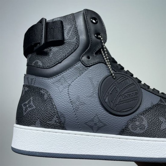 L Rivoli Monogram Canvas High Top Trainers Black Grey Charm Detail L Rivoli Monogram Canvas High Top Trainers Black Grey close up of side charm detail