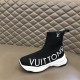 L Run Knit Sock Sneaker Boot Outer Lateral View in black and white Lateral side view of the black knit sock sneaker boot highlighting the chunky white sole.