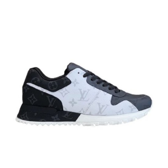Studio Profile View of L Trainers in grey and white Studio profile shot of L grey and white low top trainers