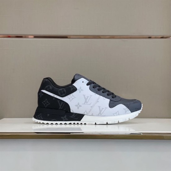 Lateral View of L Trainers in grey and white Lateral view of L grey and white low top trainers on display