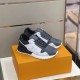 Pair of L Trainers on Box in grey and white Pair of L grey and white low top trainers resting on a branded box