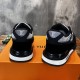 Rear view of L Run Away Mesh Panel Monogram Midsole Trainers in black and grey Rear view of L Run Away Mesh Panel Monogram Midsole Trainers showing heel branding in black and grey