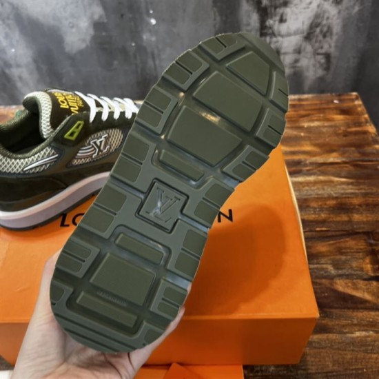 Underside view of L green trainer showing treaded rubber outsole pattern