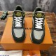 Front view of L green trainers showing lace-up closure and mesh toe box