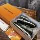 Pair of L green trainers neatly arranged inside branded storage box