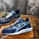 L blue mesh suede low top trainers pair displayed close up L blue mesh suede low top trainers pair displayed close up