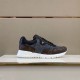 Studio display view of L Run Away Monogram Pattern Black Brown Sneakers L Run Away Monogram Pattern Black Brown Sneakers displayed on a shelf in studio lighting