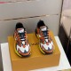L Runner Tatic Trainers Frontal View in orange and yellow Frontal top angle view showcasing the toe box and lacing of the L Runner Tatic trainers in orange and yellow
