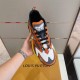 L Runner Tatic Trainers Top View in orange and yellow Top-down view of the L Runner Tatic orange trainers highlighting laces and tongue branding in orange and yellow