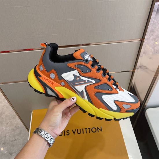L Runner Tatic Trainers Handheld View in orange and yellow Handheld lateral view emphasizing the orange suede overlays of the L Runner Tatic trainers in orange and yellow