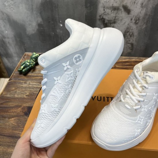L white trainers side angle Angled side view of L white trainers