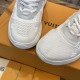 L white trainers toe detail Top down view of L white trainers toe box